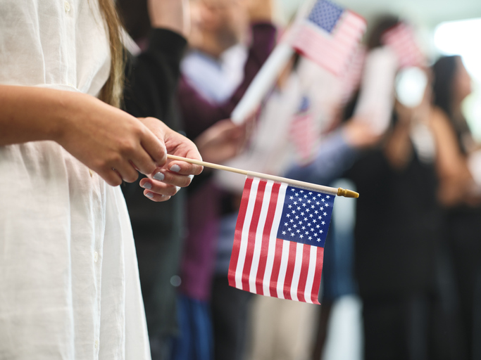 k Group of People Taking the USA Naturalization Oath of Allegiance