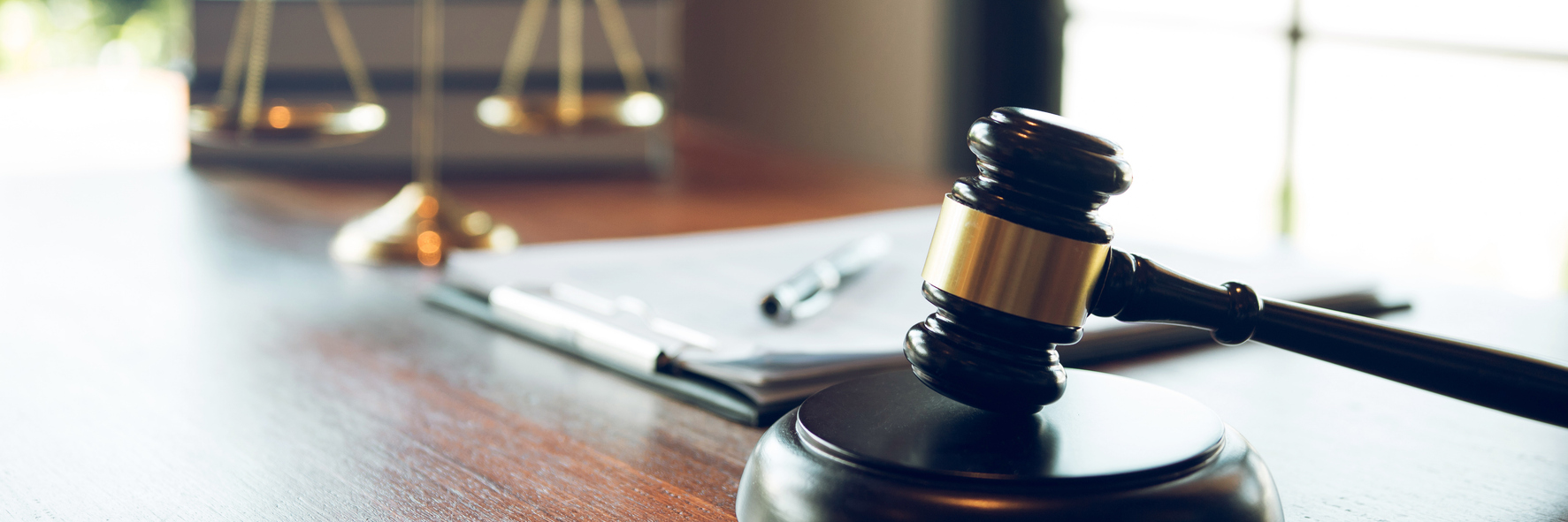 Immigration documents and a gavel on top of a desk
